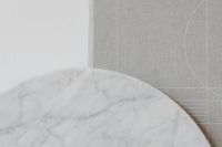 Kaboompics - Wide Marble Disc with Gray Geometric Fabric for Editorial and Web Backgrounds