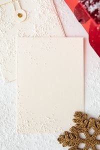 Kaboompics - Blank Christmas Greeting Card with a Gold Snowflake and Red Gift