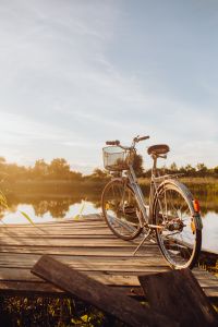 Kaboompics - Bicycle with basket on the pier in bright sunset light