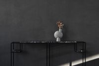 Kaboompics - Wide Black Marble Console with Sculptural Vase and Charcoal Wall Copy Space