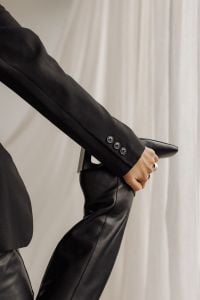 Kaboompics - Black Blazer Sleeve, Rings and Pointed Boot Close-Up