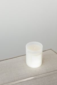 Kaboompics - Blank-Label Candle on Sofa Arm with Soft Neutral Space