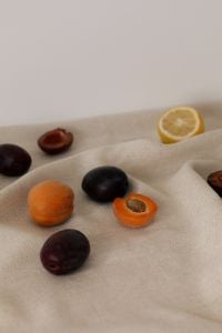Kaboompics - Close-Up Fruit Pieces and Citrus on Linen