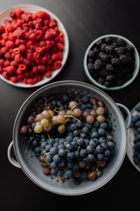Kaboompics - Mixed Grapes and Berries in a Metal Colander