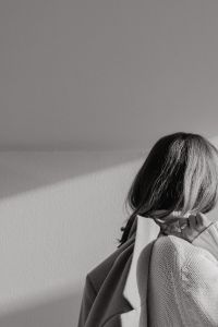 Kaboompics - Black and White Faceless Woman in White Sweater and Beige Coat