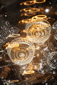 Kaboompics - Champagne Coupes and Disco Balls with Golden Light Trails