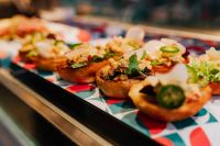 Kaboompics - Spanish Tapas Toasts with Greens on Colorful Serving Tray