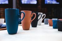Kaboompics - Colorful Ceramic Mugs on White Tabletop