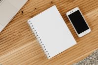 Kaboompics - Smartphone, Laptop and Blank Notebook on Wooden Desk, Minimal Home Office Flat Lay