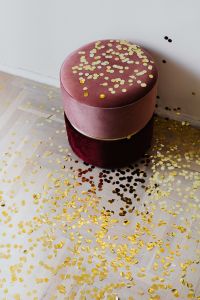 Kaboompics - Pink Velvet Ottoman Covered In Gold Confetti