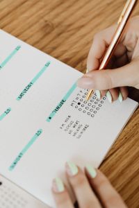 Kaboompics - Close-Up of Gold Pen on Bullet Journal Tracker