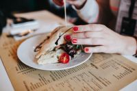 Kaboompics - Woman eating a vegetable sandwich