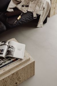 Kaboompics - Open Magazine on a Travertine Coffee Table