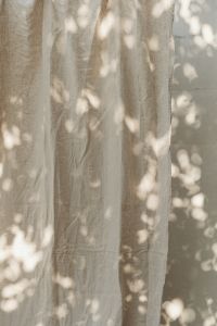 Kaboompics - Natural Linen Curtain Backdrop with Dappled Shadows