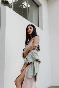 Kaboompics - Asian Fashion Portrait in Pale Dress and Gray Jacket beside White Wall