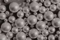 Kaboompics - Black and White Pearl Bead Texture Background on Gray Concrete, Monochrome Close-Up