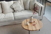Kaboompics - Wooden Coffee Table with Vase and Neutral Pillows