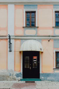 Kaboompics - Pastel Historic Facade with Arched Entrance