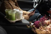 Kaboompics - Drink Carrier With Iced Matcha and Coffee Cups in a Car
