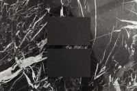 Kaboompics - Two Black Blank Business Cards Stacked on Veined Marble, Wide Stationery Mockup