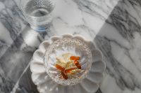 Kaboompics - Amber and Herbal Capsules in a Decorative Shell Bowl