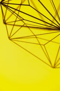 Kaboompics - Geometric decoration on yellow background