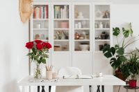 Kaboompics - Red Roses, Planner and Coffee on White Desk with Monstera, Home Office Scene