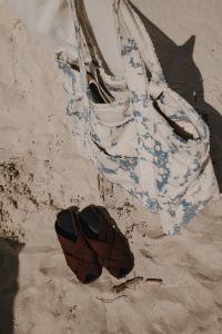 Kaboompics - Floral Beach Bag and Brown Sandals on the Sand