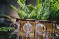 Kaboompics - A big bunch of wine glasses hanging from a holder