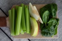 Kaboompics - Celery Sticks, Apple and Spinach on a Wooden Board