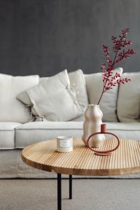 Kaboompics - Wooden Coffee Table and Candle Beside Linen Sofa