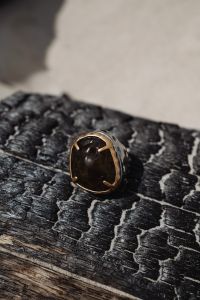 Kaboompics - Gold Ring on Textured Driftwood