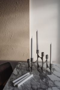 Kaboompics - Chrome Candelabra and White Candles on Arabescato Marble Table