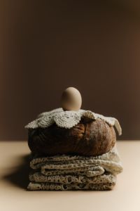 Minimal Still Life With Eggs Bread And Flowers Inspired By Easter