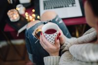 Kaboompics - Woman drinking hot tea in her home office