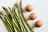 Kaboompics - Overhead Asparagus Spears and Brown Eggs, Healthy Recipe Ingredients on White