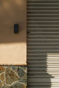 Kaboompics - Metal Roller Shutter and Stone Base