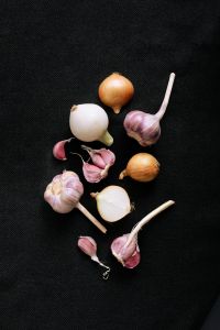 Kaboompics - Onions and Garlic on a Dark Background