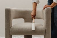 Kaboompics - Lint Roller Cleaning an Upholstered Chair