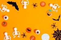Kaboompics - Orange Halloween Party Flat Lay With Skeletons
