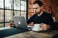 Kaboompics - Young Entrepreneur Working with cup of tea