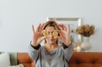 Kaboompics - Woman Holding Bitcoin Coins Over Her Eyes