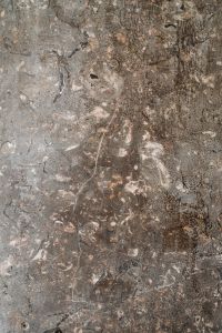 Kaboompics - Dark Mottled Stone Texture Background