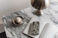 Kaboompics - Chrome Dome Lamp, Planner and White Round Object on Arabescato Marble
