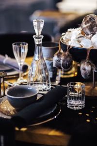 Kaboompics - Fancy restaurant dinner table decorated with quail eggs and feathers