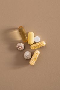 Kaboompics - Small Group of Vitamins and Capsules with Shadows