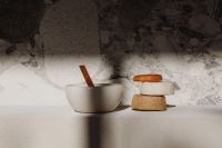 Kaboompics - Handmade Soap Bar Stack with Wooden Scoop and Ceramic Bowl