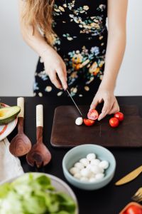Kaboompics - Close-Up of Cherry Tomatoes, Garlic Cloves and Avocado for Salad Prep