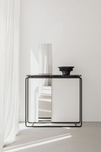 Kaboompics - Minimal Black Marble Console With Ceramic Vase And Mirror