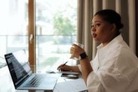 Kaboompics - Black Woman Taking a Work Break by Window
